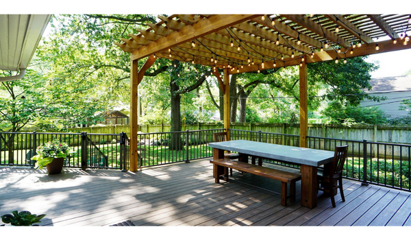 Custom cedar pergola with climbing plants in Lenexa, Kansas